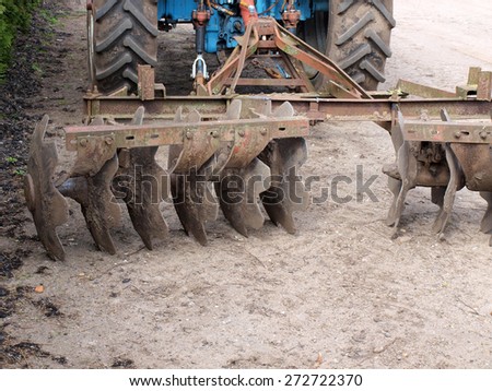 Tractor powered heavy disc harrows on ground