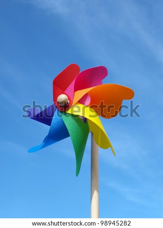Color windmill toy on the sky background