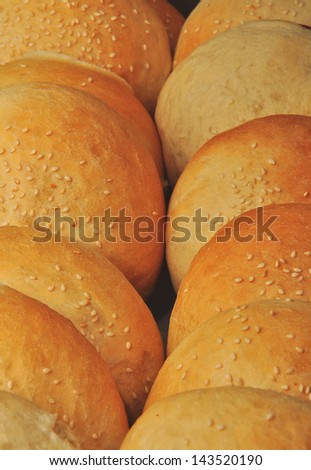 preparation of bread for burgers
