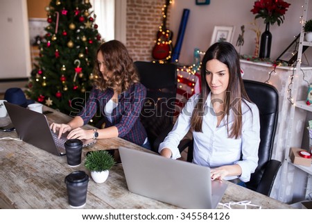 Young women working at home office or co-working space, modern design, depth of field