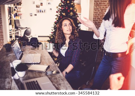 Young women working at home office or co-working space, modern design, depth of field
