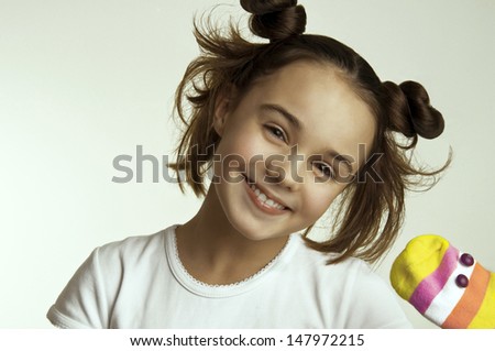 Laughing little girl with toy snake