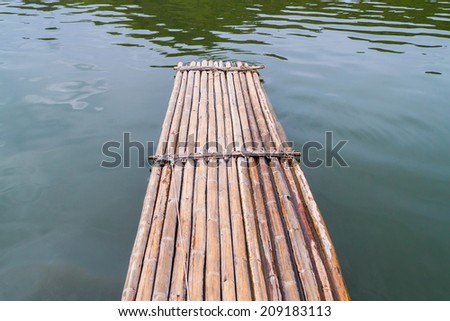 Bamboo raft floating over a river