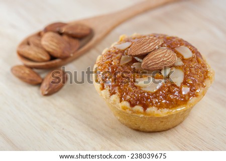 almond cake isolate on a wooden table