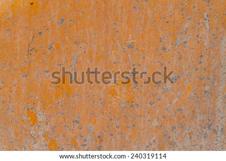 Dry concrete drop on Orange metal sheet background
