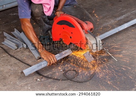 Cutting steel with on protection, hand cutting, work  and safety concept