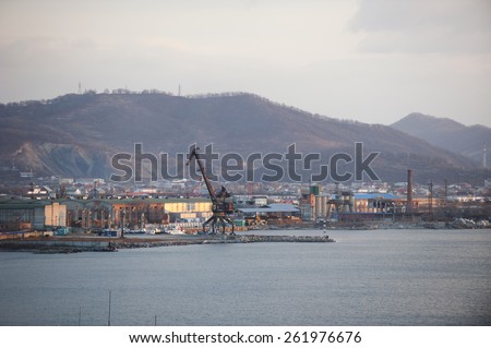 The loading crane in the port city of Nakhodka.Pierce. Industrial landscape