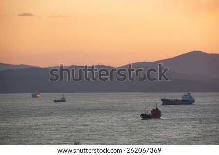 Sunset  over the mountains of Sea port of Nakhodka. seascape.Nakhodka commercial sea port