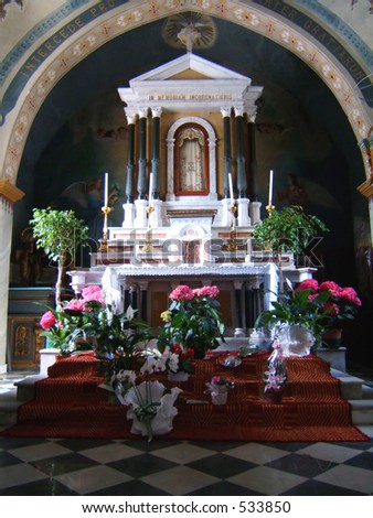 a church altar with flower offering