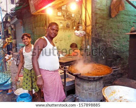 Varanasi, India - December 2012 - Unidentified Man Cooks Meal For Sale In Street Restaurant In Varanasi, December 2012.