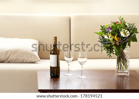bottle of wine and glasses in living room