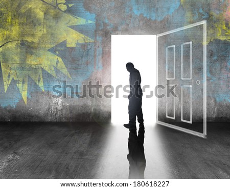 man walking out of door