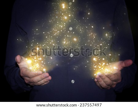 magic sparkles in hands