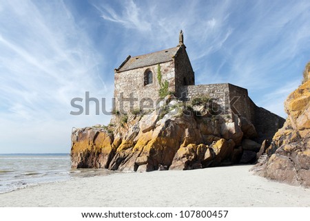 Small chapel situated on the edge of the sea behind the main part of Mont Saint Michel, Normandy, France