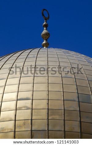 Detail shot of the golden dome that crowns the Dome of the Rock in the Old City of Jerusalem, Israel.