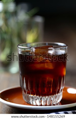 Ice black coffee on plate