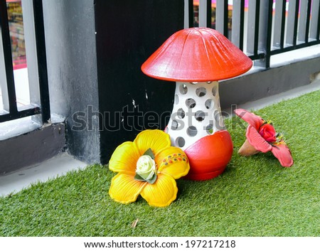 Colorful statue mushroom on yard.