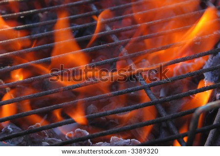 Just lighting the barbecue and the flames are coming up through the grill