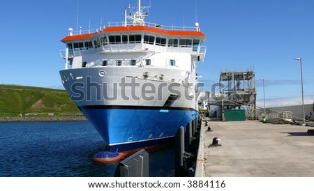 A view of the front of a modern ferry and the bridge note the crew member painting.