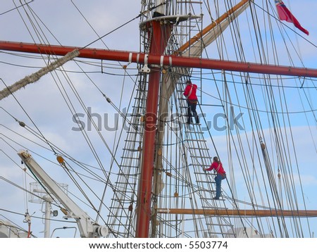Crew members climbing the rigging