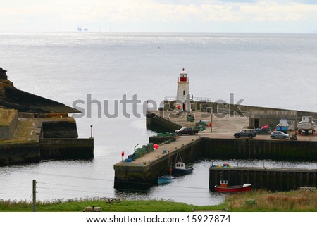 A small harbour is a safe place to be when the sea is not as calm. Lybster northern Scotland