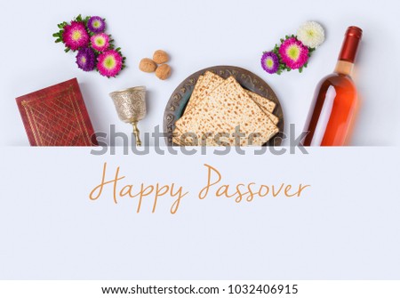 Jewish holiday Passover banner design with wine, matzo and seder plate on white background. View from above. Flat lay