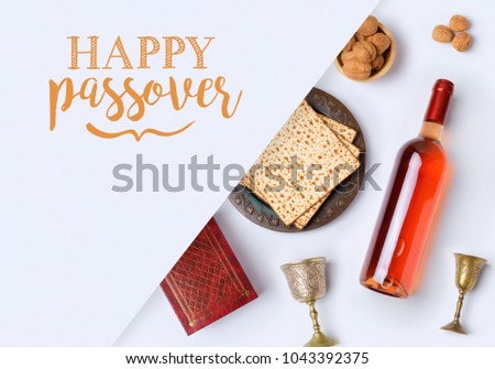 Jewish holiday Passover banner design with wine, matzo and seder plate on white background. View from above. Flat lay