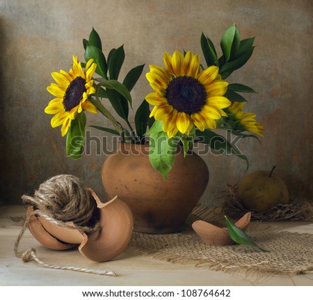 Still life with sunflowers and broken vase
