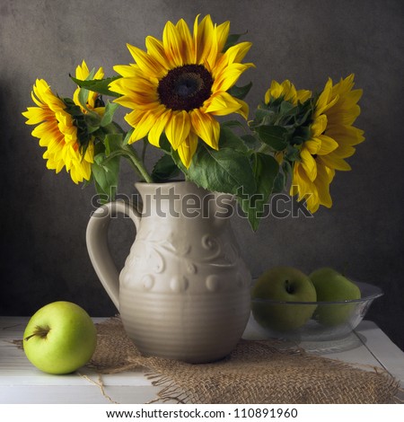 Classical still life with beautiful sunflowers bouquet