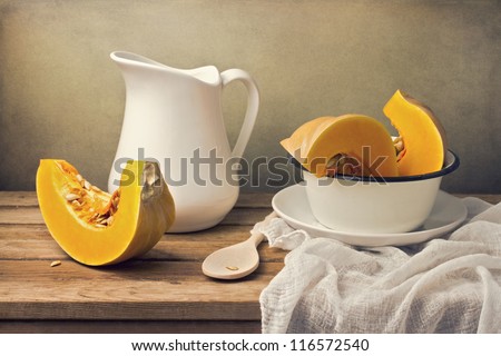 Still life with pumpkin and white jug