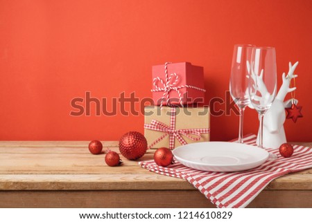 Christmas dinner table setting with empty plate and decorations. Christmas and New Year background