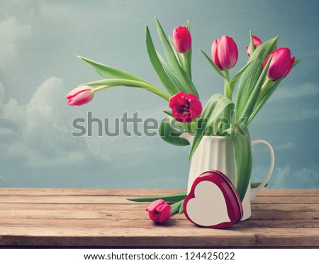 Valentine's Day concept Beautiful tulip bouquet with heart shape box Valentine's Day concept Beautiful tulip bouquet with heart shape box