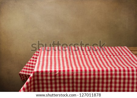 Background With Table And Tablecloth Over Grunge Background