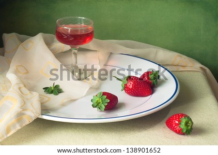 Still life with strawberry and glass of wine