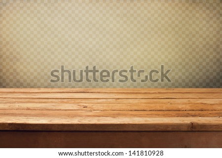 Vintage Background With Wooden Deck Table Over Grunge Wallpaper With Squares