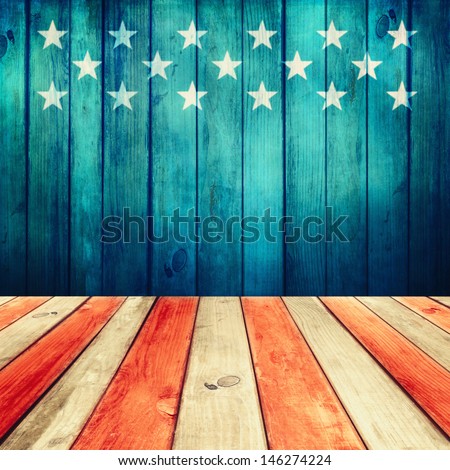 Empty wooden deck table over USA flag background. USA national holidays. Ready for product display montage.