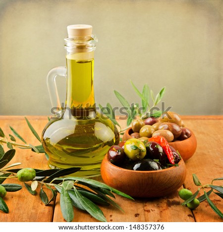 Marinated Olives With Oil In Wooden Plates