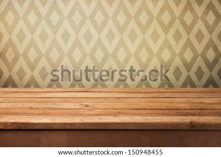 Vintage background with empty wooden table and wallpaper with retro pattern