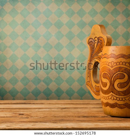 Wooden Beer Mug On Wooden Table Over Retro Wallpaper. Oktoberfest Holiday