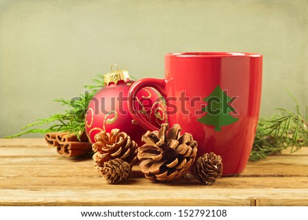 Christmas Mug With Pine Corns And Ornaments On Wooden Table