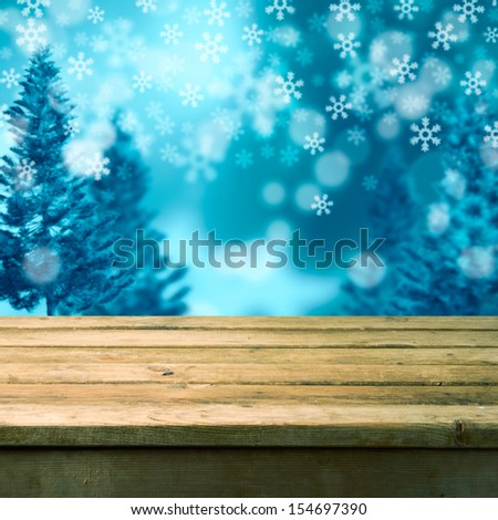 Winter background with empty wooden table. Ready for product montage display
