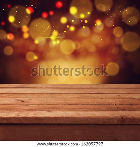 Christmas Bokeh Background With Empty Wooden Table. Perfect For Product Display Montage