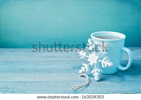 Winter drink with wooden snowflake decoration
