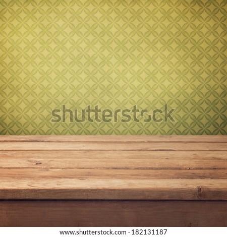 Vintage background with wooden deck table and retro wallpaper