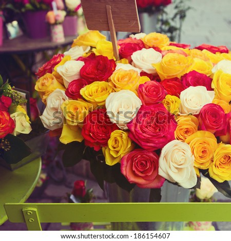 Flower market shop on street in Paris, France. Rose flower bouquet.