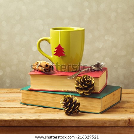 Christmas tea mug on books with decorations