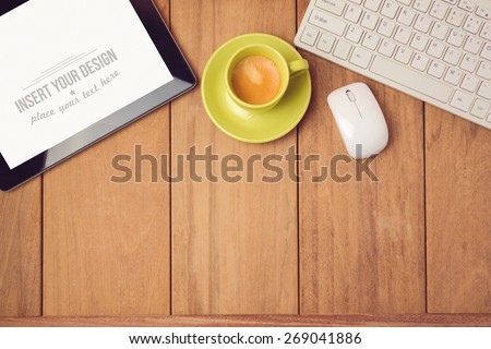 Office desk mock up template with tablet, keyboard and coffee cup. View from above