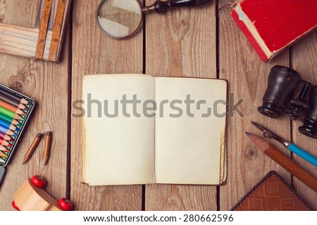 Notebook mock up for artwork or logo design presentation with hipster objects. View from above