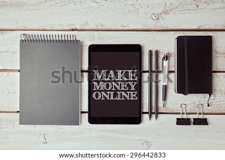 Make money concept with digital tablet and office items