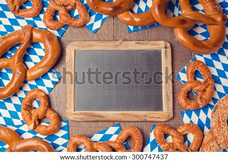 Oktoberfest german beer festival  background with chalkboard and pretzel